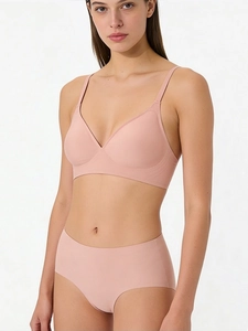 Detail of seamless dusty pink bra and high-waisted panty set with adjustable straps