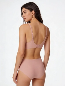 Rear view of seamless lotus pink bra and high waist panties on model with elastic fabric