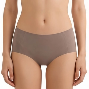 Brown seamless mid-waist panties for women with a smooth laser-cut design on model
