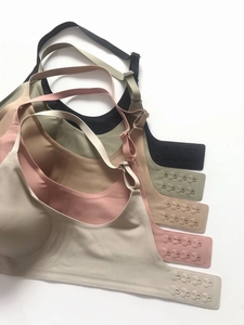 Detail of five seamless bras featuring four-row hook closures and adjustable straps