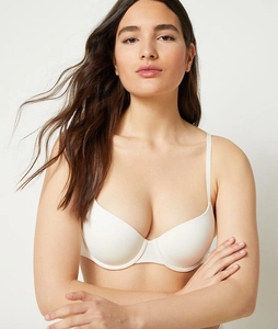 Close-up of seamless push-up bra in cream white with adjustable straps and smooth texture