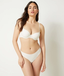 Close-up of seamless white bra and panty set made from smooth synthetic fiber