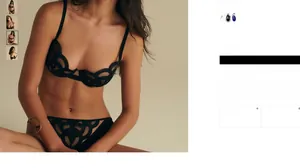 Detail of black geometric lace lingerie set with balconette bra and sheer embroidery design