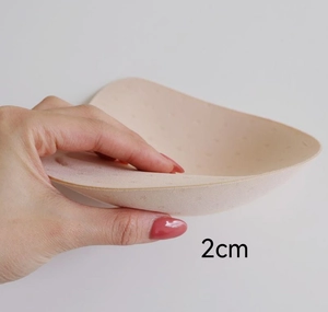 Detail of 2cm thick seamless push-up bra pad insert showing high density sponge material