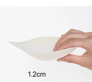 Detail view of 1.2cm thick white breathable sponge bra inserts with soft padding