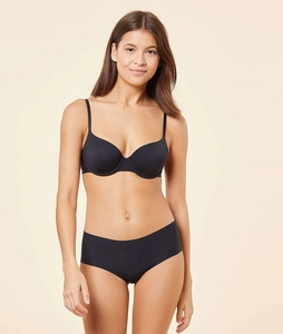 Seamless black bra and panty set shown on model with smooth fabric and thin straps