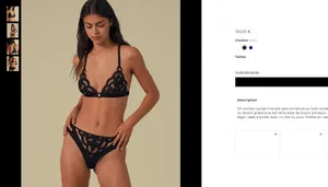 Detail of black geometric lace lingerie set with gold rings and sheer mesh fabric