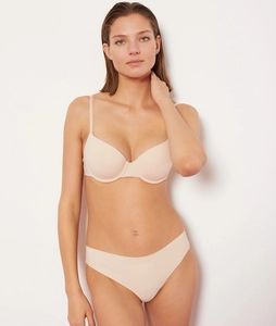 Close-up of nude seamless push-up bra set with microfiber fabric and soft texture