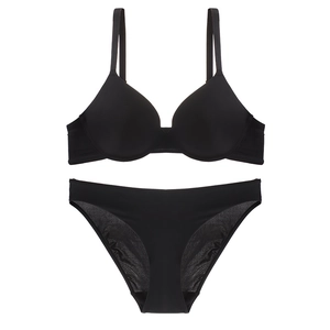 Seamless black bra and panty set with adjustable straps shown in flat lay