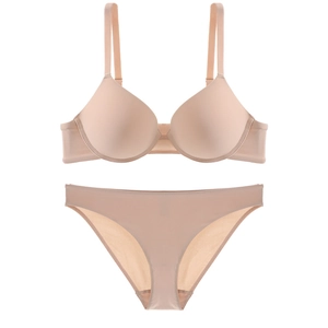 Seamless push-up wireless bra and panty set in skin-tone smooth fabric on white background