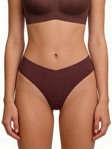 Detail of coffee brown seamless V-cut thong showing laser-cut edges and elastic fit