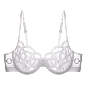 Detailed close-up of white sheer mesh bra with intricate embroidered ring textures and underwire