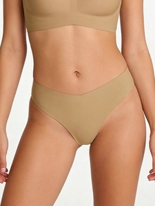 Close-up of seamless V-cut nude Brazilian thong set showing high-elasticity fabric