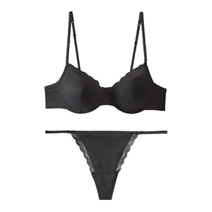 Detailed view of sexy black satin lingerie set with delicate floral lace trim detailing