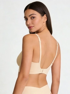 Detail of seamless beige microfiber bra set featuring adjustable straps and U-shaped back design