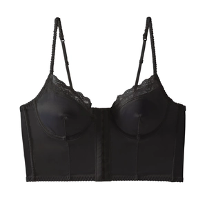 Front detail of black corset top featuring hook-and-eye closure and lace trim details