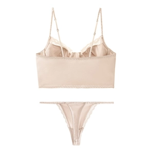 Detailed view of bohemian champagne satin lingerie set with delicate lace trim