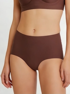 Macro shot of seamless high-waist panties in mocha brown showing the fabric texture and stretch