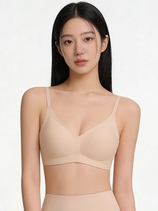 Front view of a nude seamless wireless bra with thin straps and smooth finish