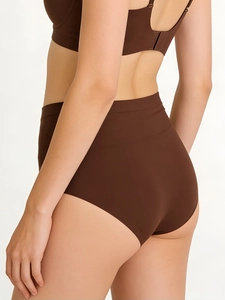 Detail view of seamless high-waist dark brown underwear with invisible smoothing edges
