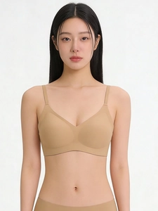 Seamless nude bralette with V-neckline and thin straps on model with a minimalist style