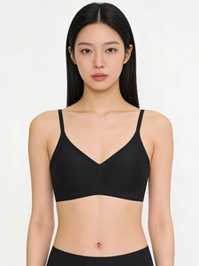 Close-up of black seamless V-neck bralette with thin straps and smooth finish