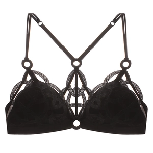 Detail of black lace bra with geometric embroidery and modern metal ring connectors