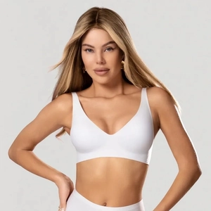 Front view of seamless white V-neck wireless bra with wide straps and smooth jelly support