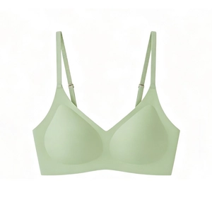 Detail of mint green seamless bralette featuring adjustable straps and soft cups
