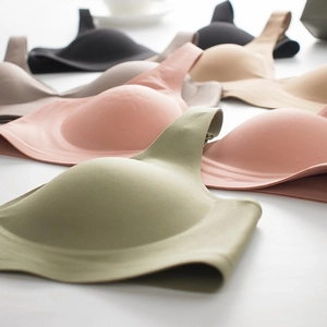 Macro detail of seamless jelly-soft support bras in various earthy color palettes