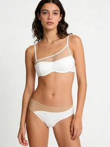 Detail of white bandeau bra with mesh patchwork and matching seamless high-waist panty set