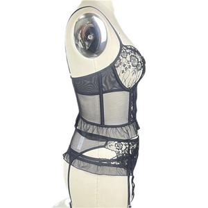 Detailed side view of black lace corset with floral embroidery and garter belt set