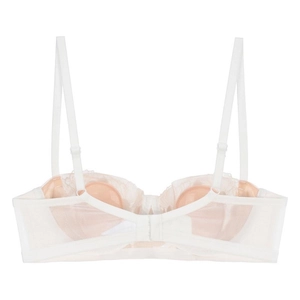 Detail of the white lace bra back showing adjustable straps and hook-and-eye closure
