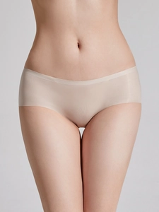 Detail view of seamless low-waist ice silk panties showing breathable fabric and skin-tone finish