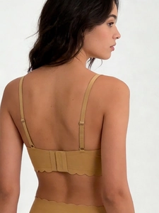 Detail view of seamless wave-edge wireless bra and panty set with adjustable back straps