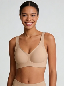 Close-up of seamless skin-tone bra with wide straps and smooth elastic fabric