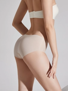 Rear view of seamless nude cooling underwear on model showing invisible fit and sleek edges