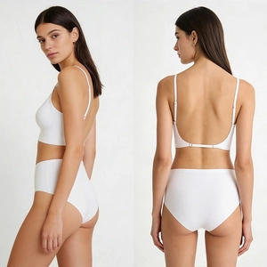 Detail view of white seamless backless bra with cross straps and high waist panties set