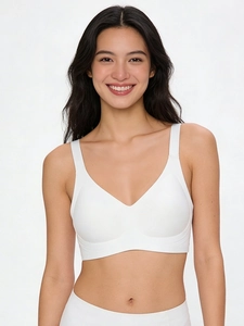Close-up of white seamless plus-size bra with wide shoulder straps and V-neckline support