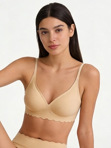 Close-up of seamless nude bra with wave cut edges and high-stretch fabric detail