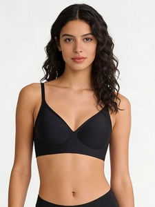 Close-up of black seamless wire-free bra with V-neckline and adjustable straps