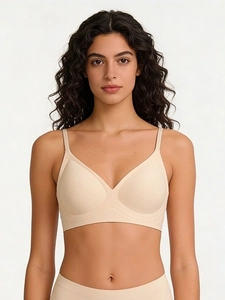 Detail of nude seamless wireless bra and panties with thin straps and V-neck design