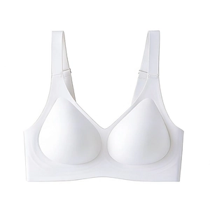 Detail view of seamless white bra featuring wide straps and jelly support strips