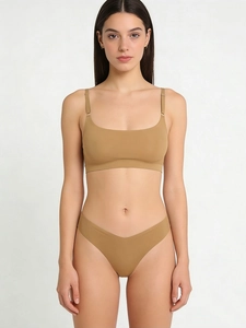 Detail view of seamless caramel lingerie set featuring thin straps and V-cut panties