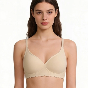 Seamless nude wireless bra with scalloped wave edges and soft jelly strip support