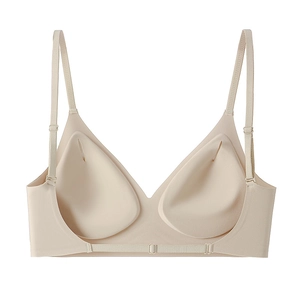 Detail view of seamless nude wireless bra with removable teardrop pads and adjustable straps