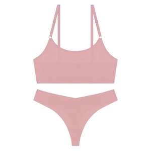 Pink seamless ultra-thin wireless bra and matching thong set on white background