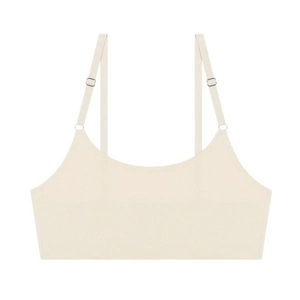 Detailed close-up of adjustable shoulder straps and seamless edge on beige bralette