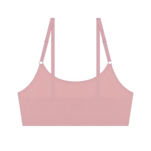 Detail of pink seamless bra featuring adjustable spaghetti straps and smooth texture