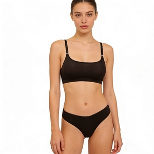 Seamless black minimalist lingerie set with thin straps and low-rise thong for women